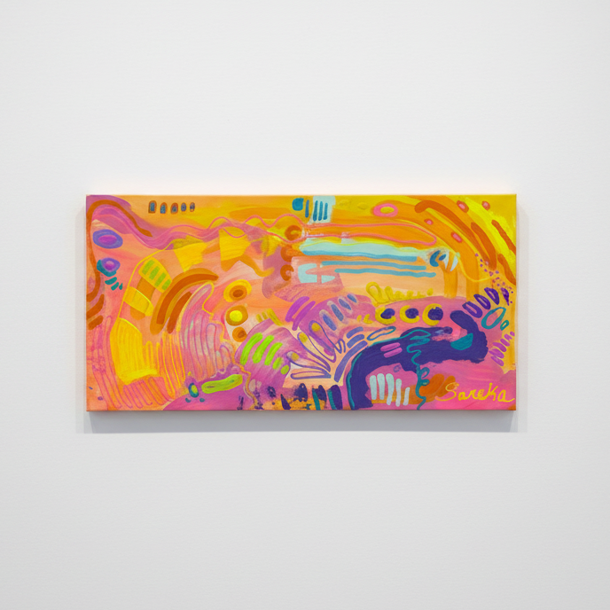 A colorful abstract canvas painting mounted on a light gray wall. The artwork features a vibrant mix of pink, yellow, orange, purple, and green abstract shapes and brushstrokes.